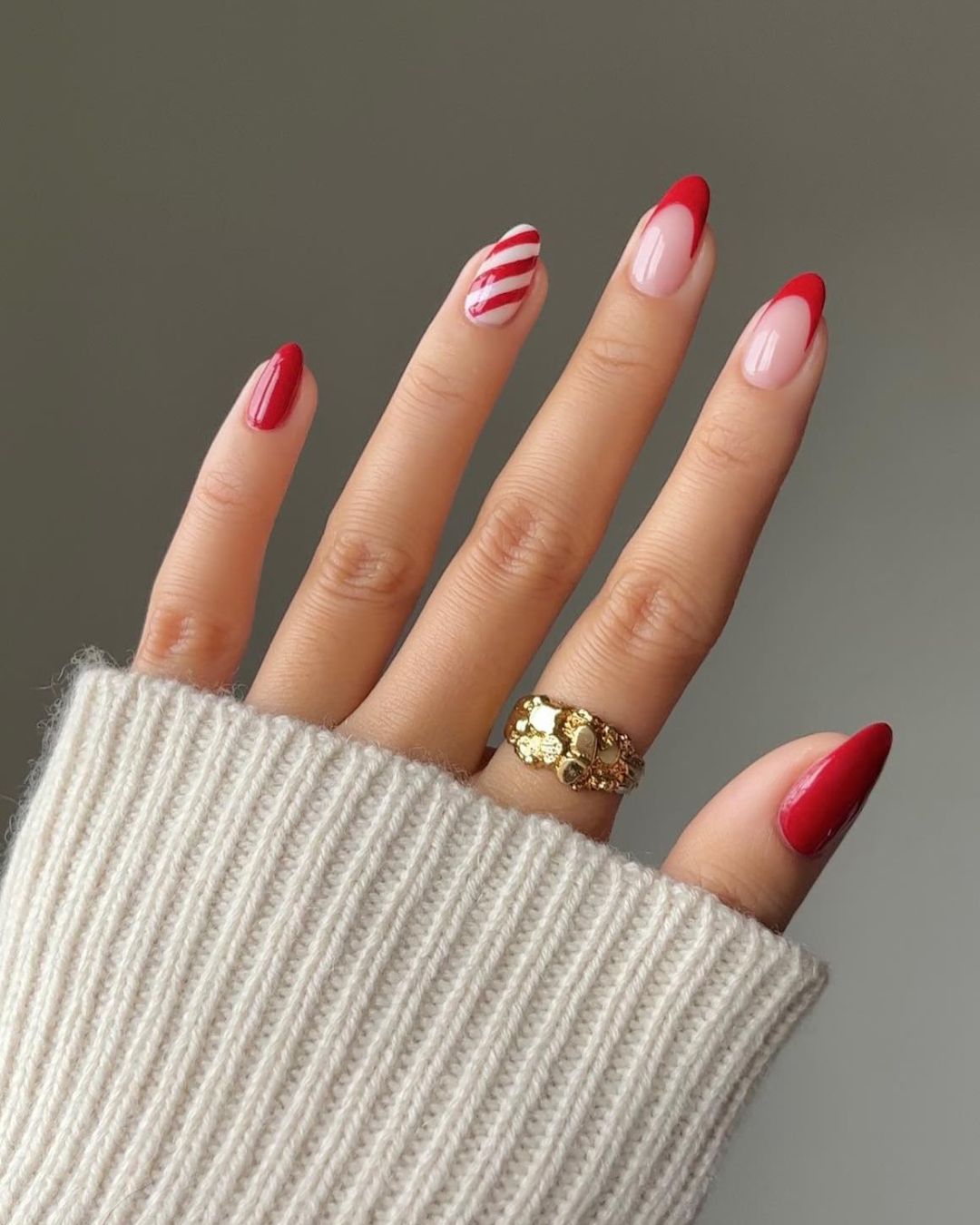 Red frenchies and candy cane stripes accent nail