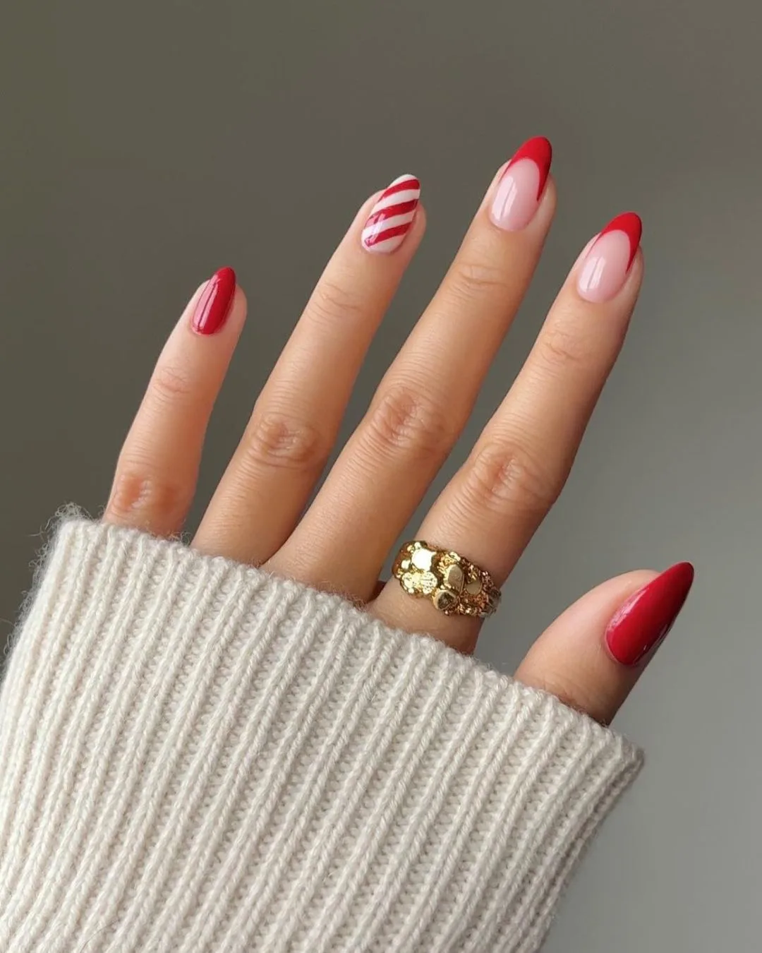 Red frenchies and candy cane stripes accent nail