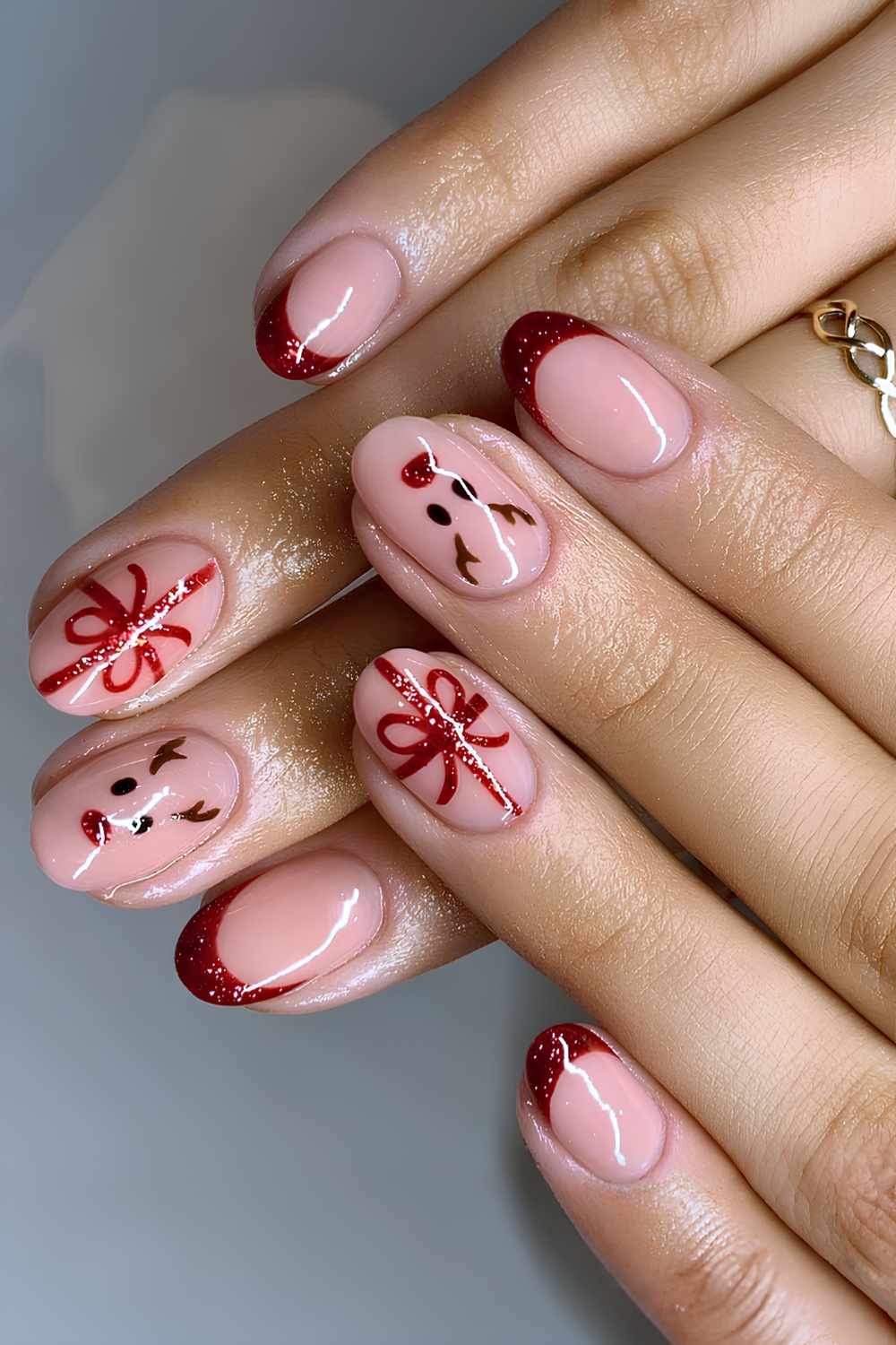 Red glitter French mani with bow and reindeer art