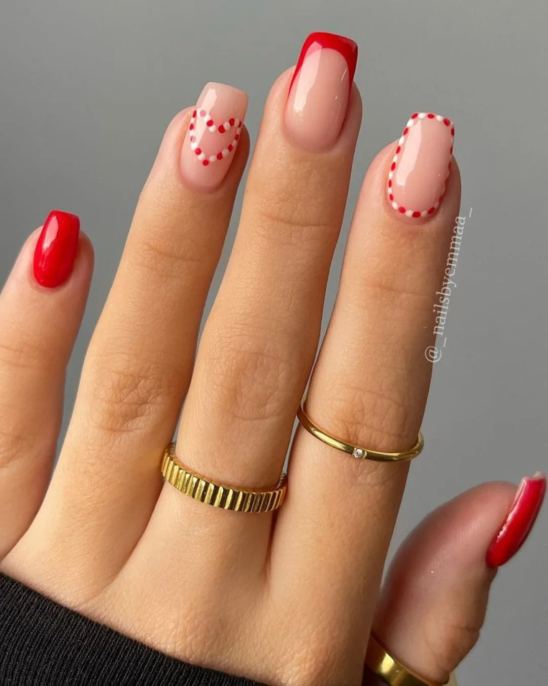 Red solid and French nails with candy cane heart accent nail