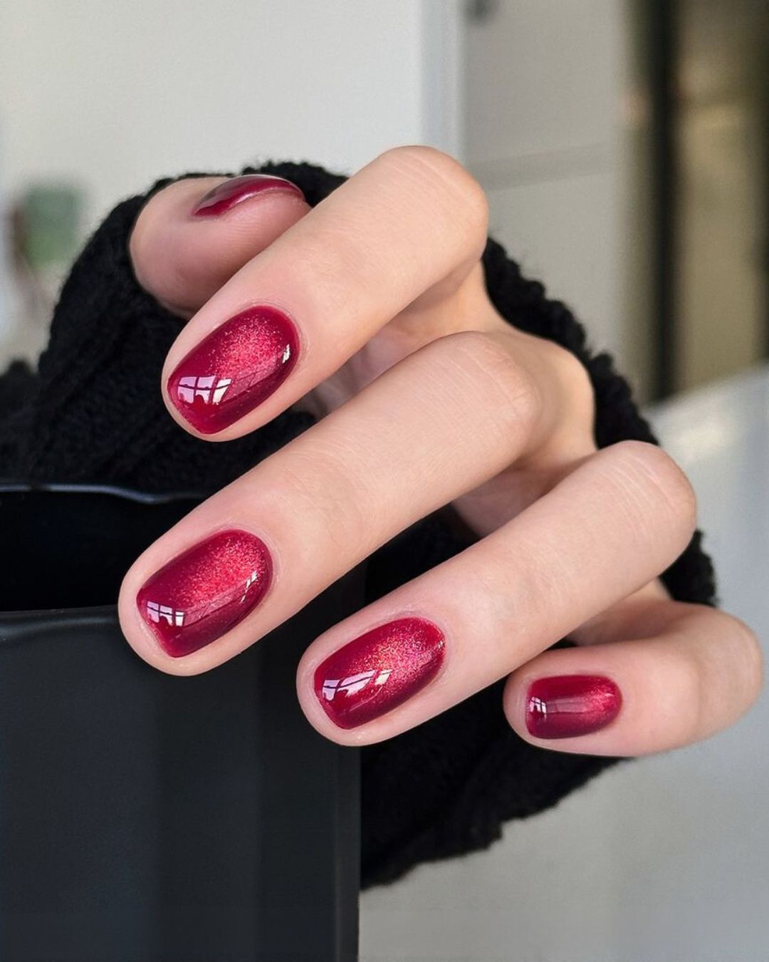 Red velvet manicure with cat eye effect