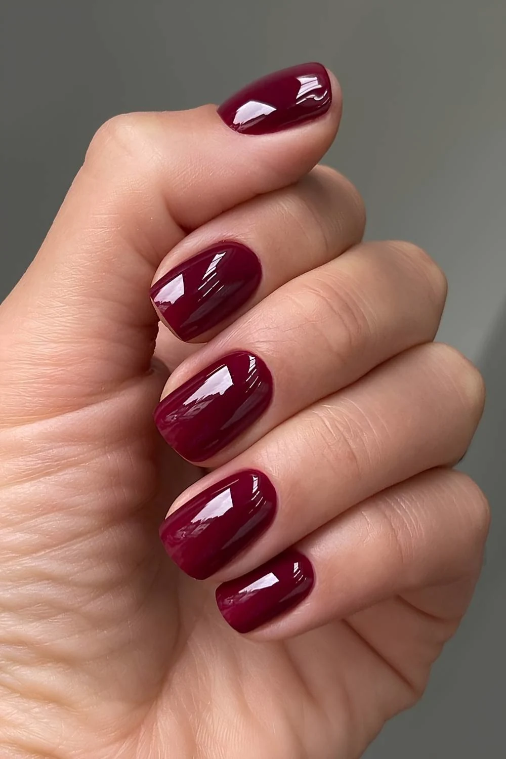 Short deep red nails