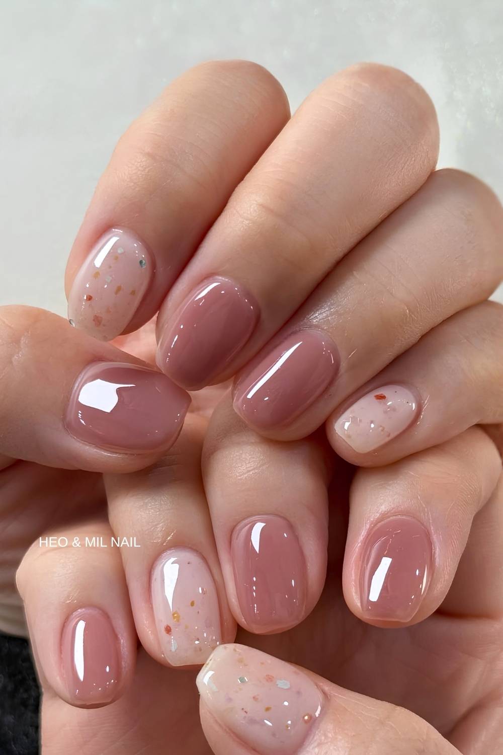 Short mauve nails with holo flake accents