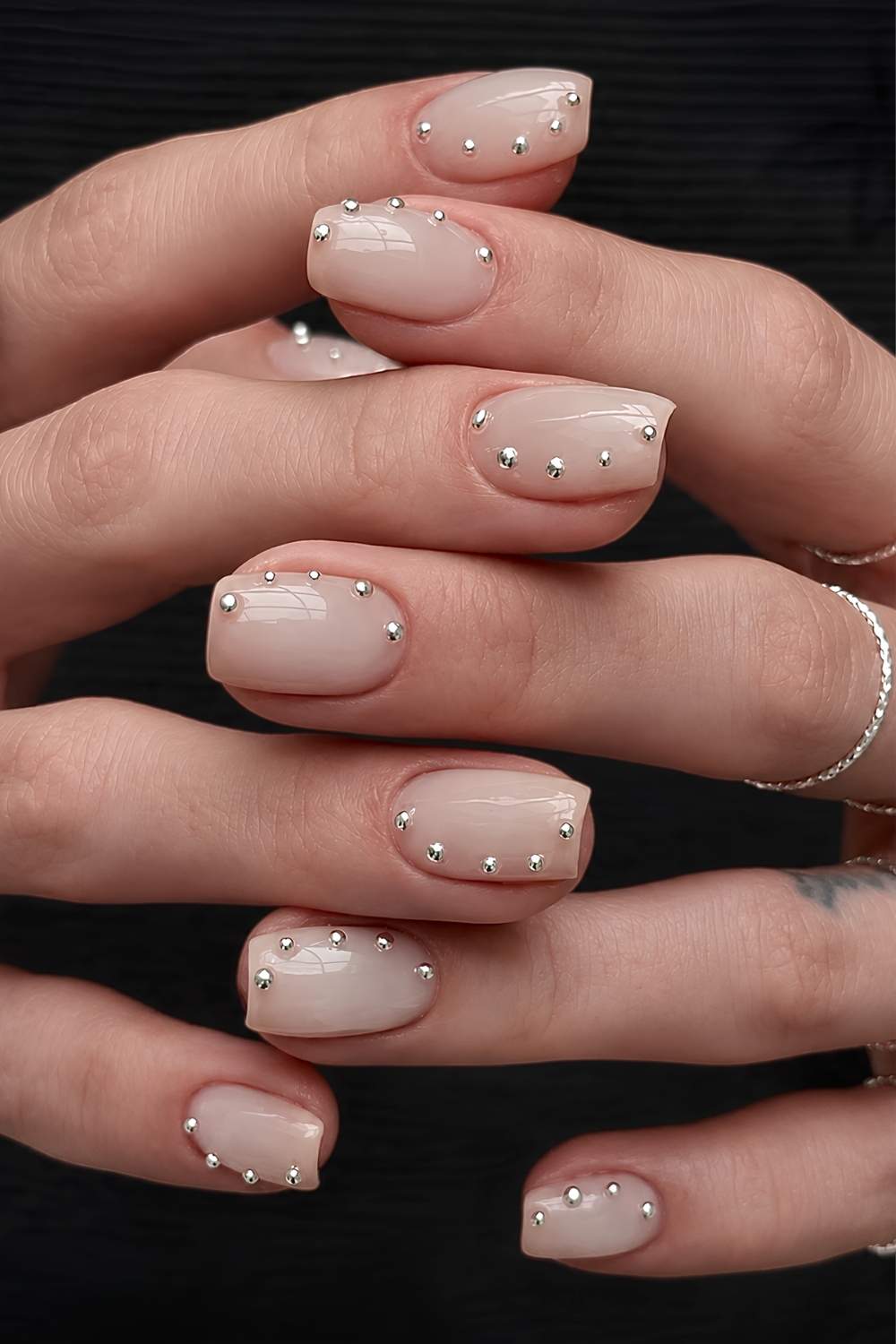 Short milky white mani with pearl trail accent