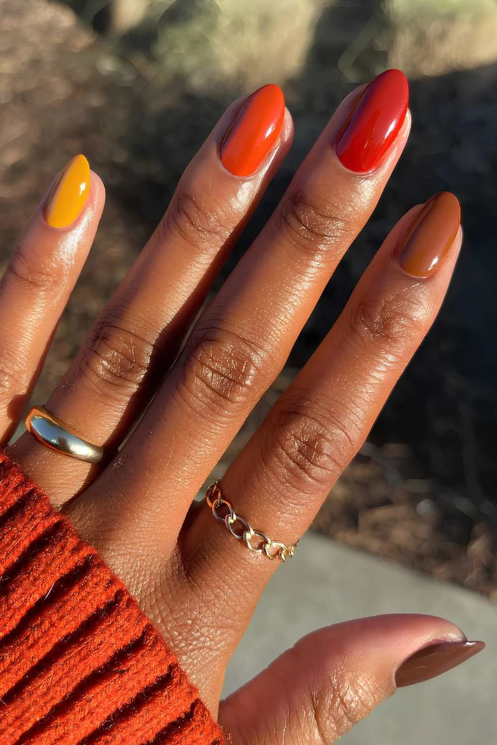 Skittle mani in orange and brown tones