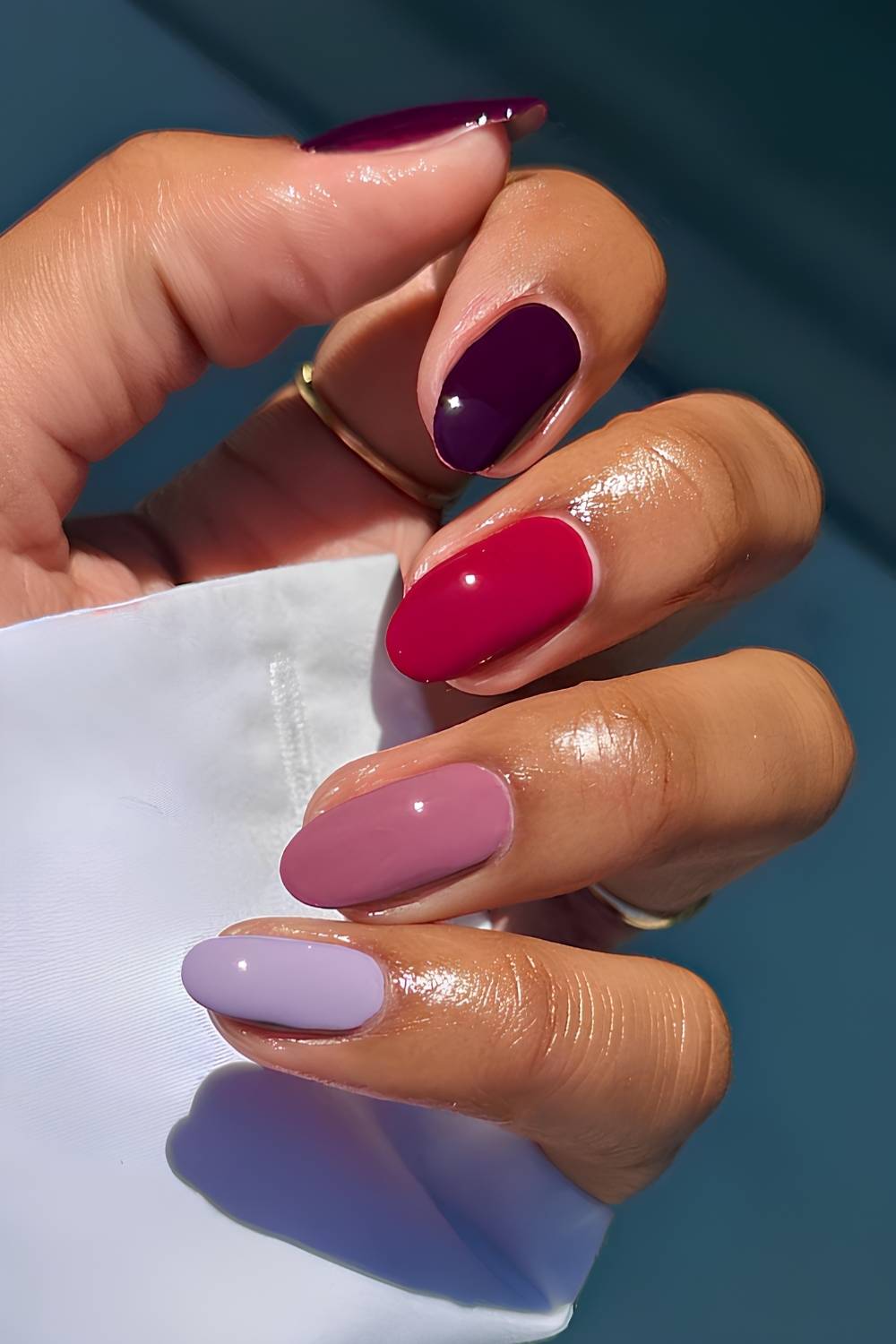 Skittle nails in plum and red tones