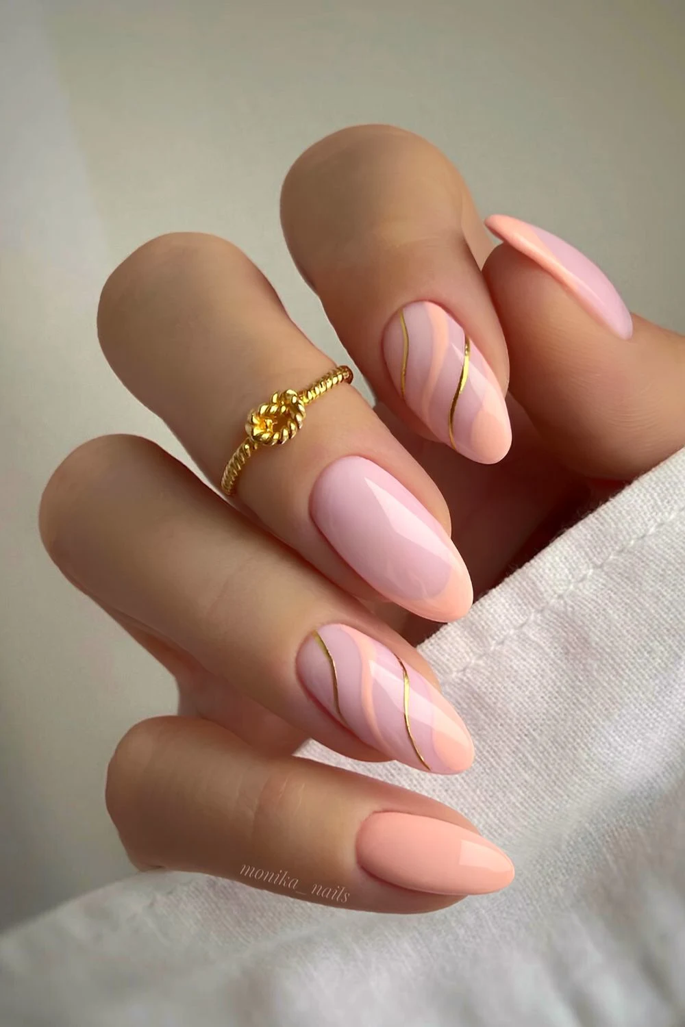 Soft peach nails with swirls