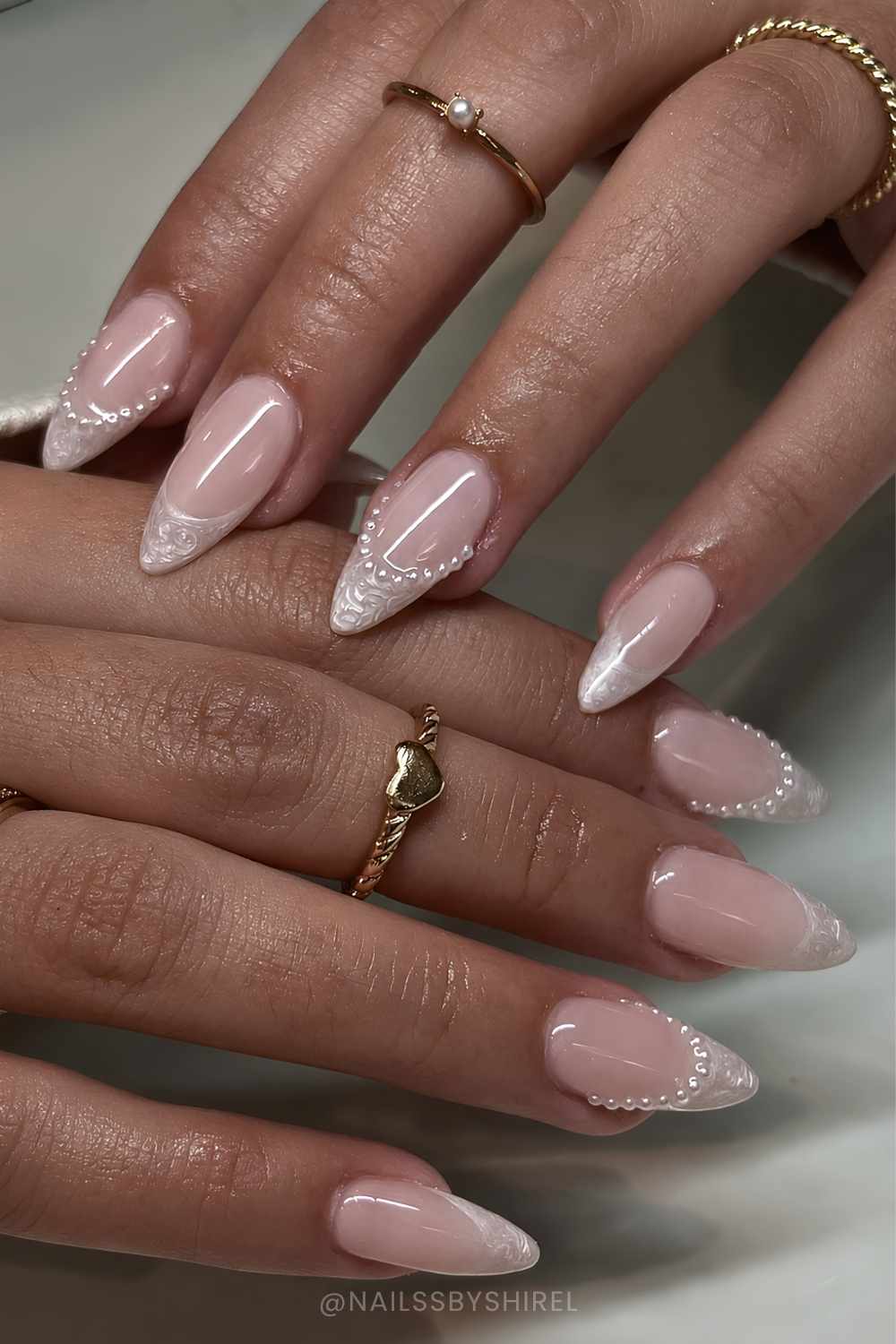 Swirly French mani with mini pearl accents