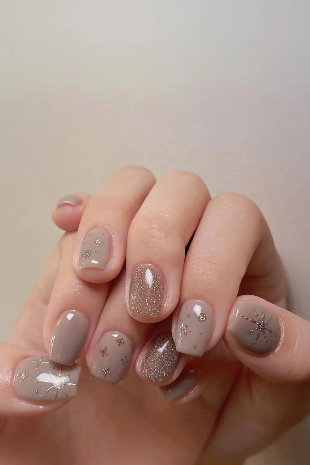 Taupe nails with celestial accents