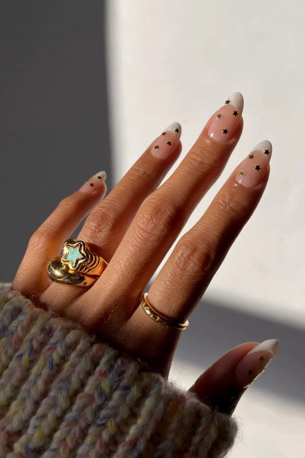 White french tip nails with star decals