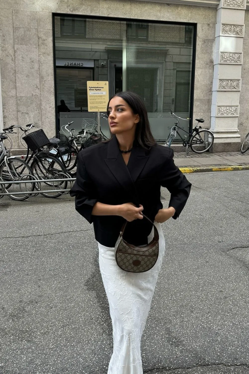 black boxy blazer paired with white lace skirt