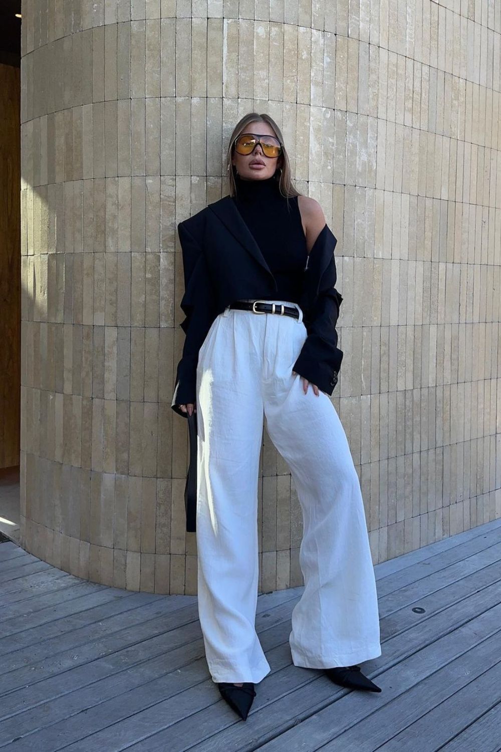 black cropped blazer with white trousers and heels