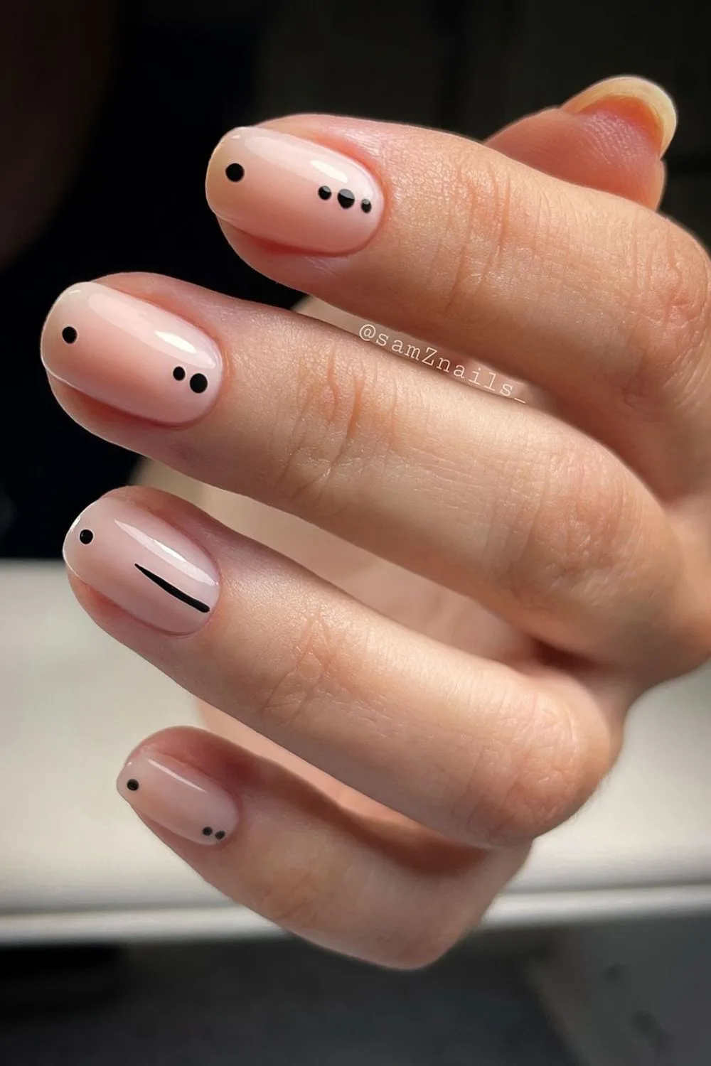 black dots and lines on nude nails