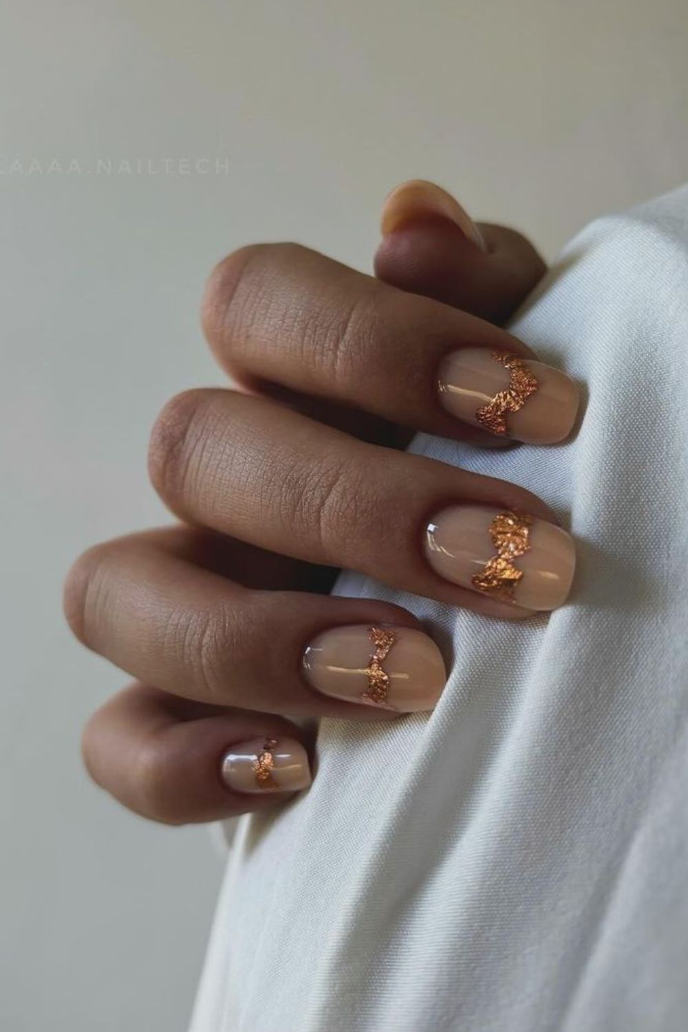 rose gold accents on nude nails