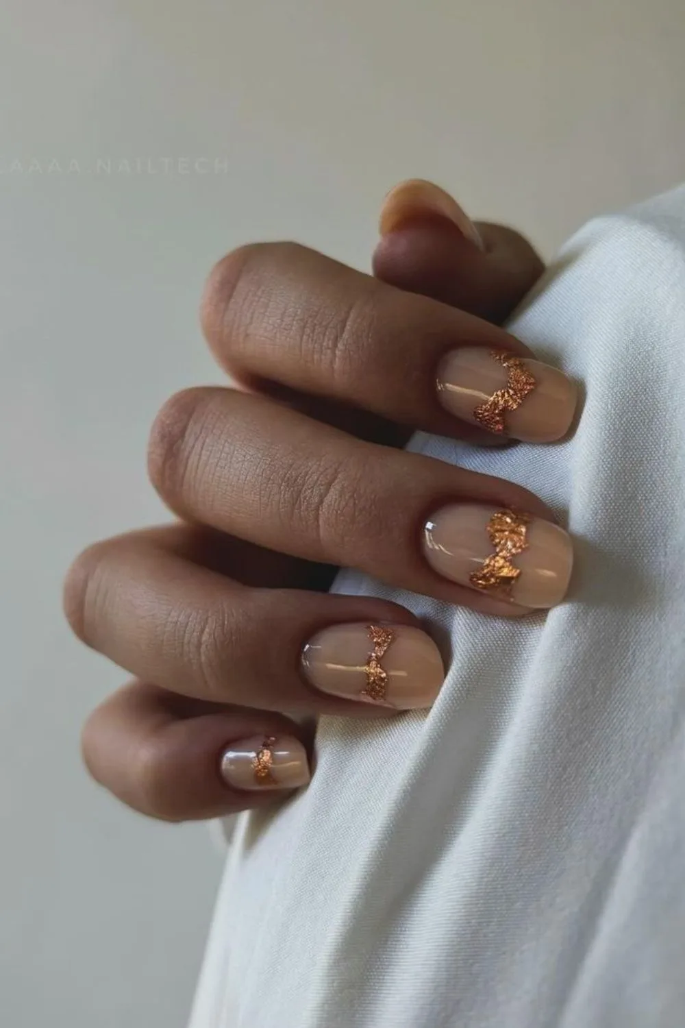 rose gold accents on nude nails