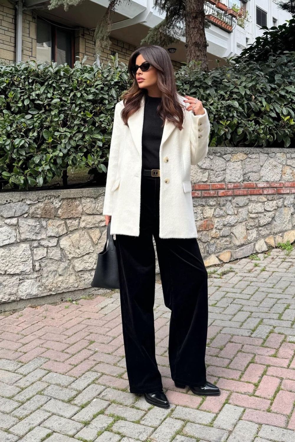 white blazer paired with black pants and t-shirt