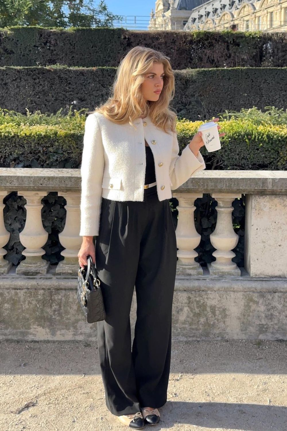 white tweed jacket paired with black trousers