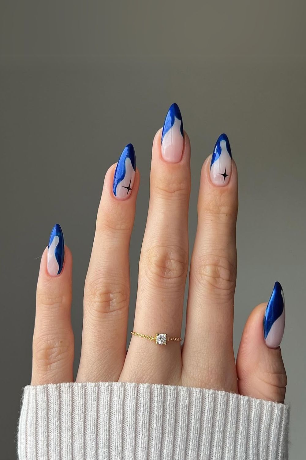 Abstract sapphire blue nails with celestial accents