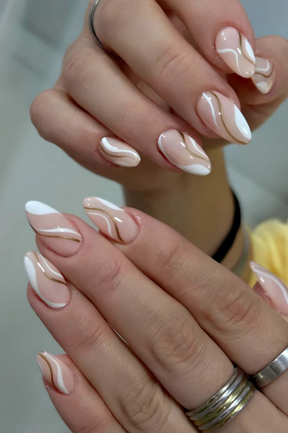 Abstract white French mani with gold swirls