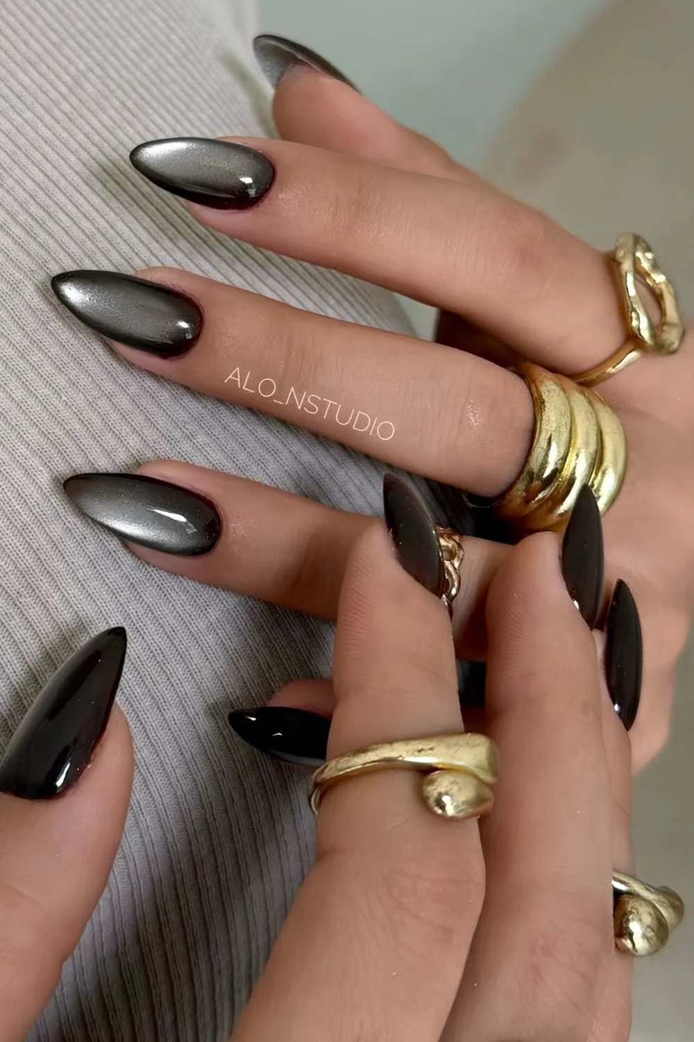Almond black cat eye nails