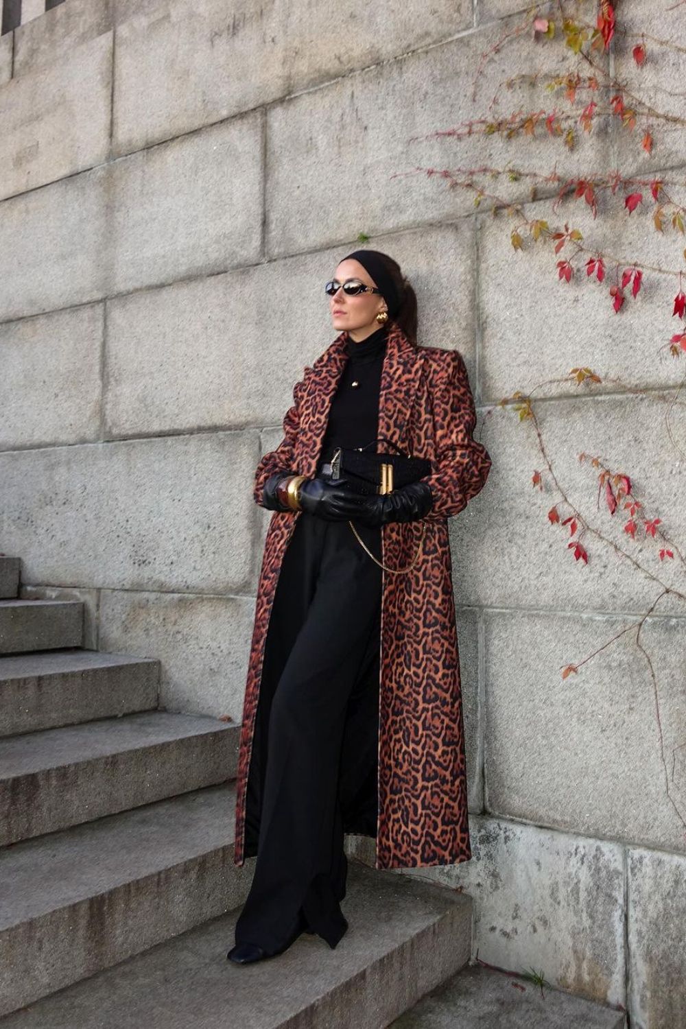 Animal print coat paired with black wide-leg pants and shirt with headband