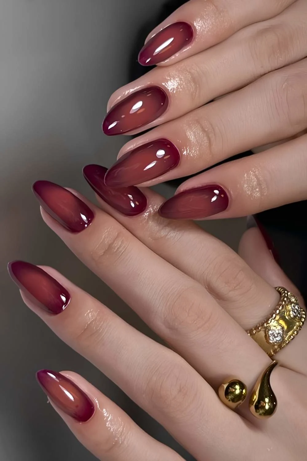 Aura nails in two shades of red
