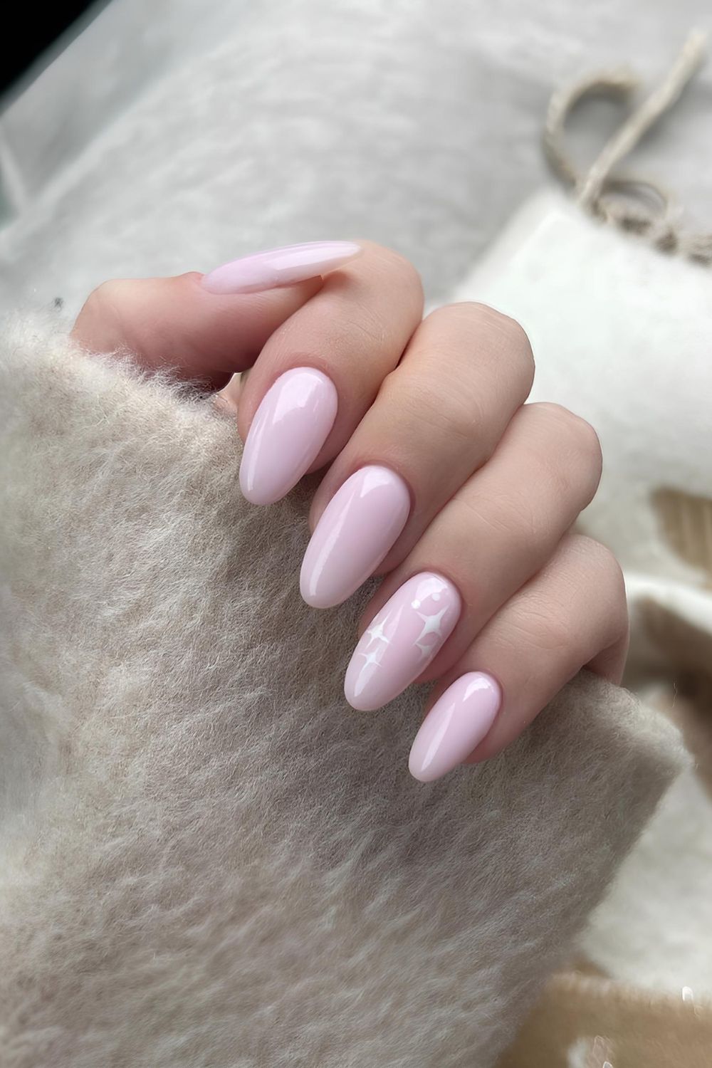 Baby pink nails with tiny white stars