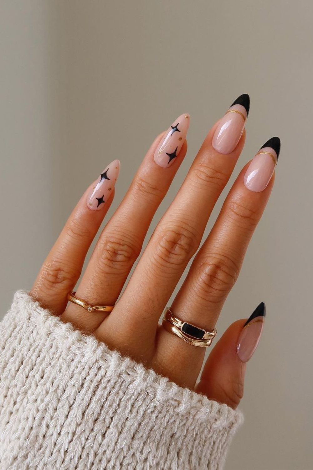 Black French mani with gold and star accents