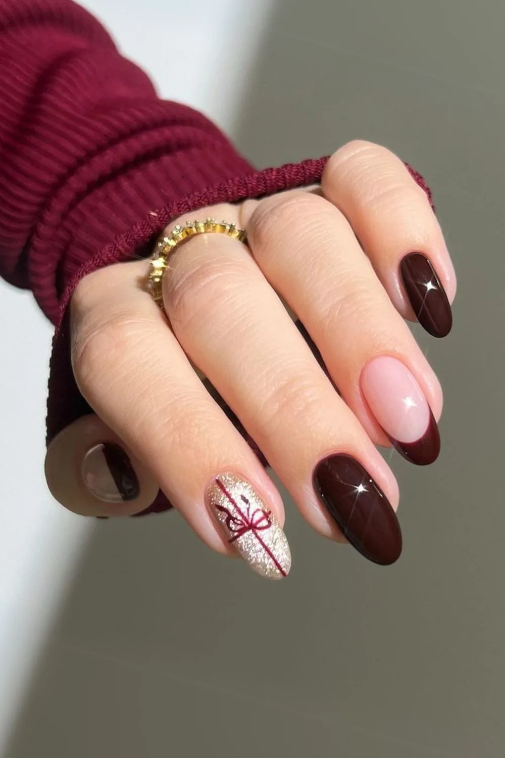 Black cherry Christmas nails with gift bow art