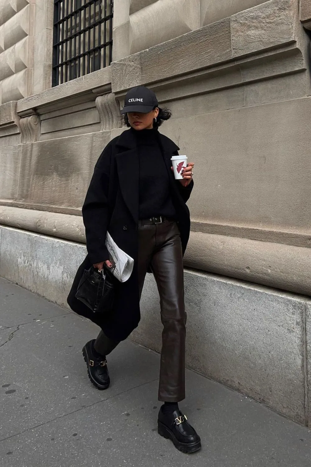 Black coat paired with black leather pants