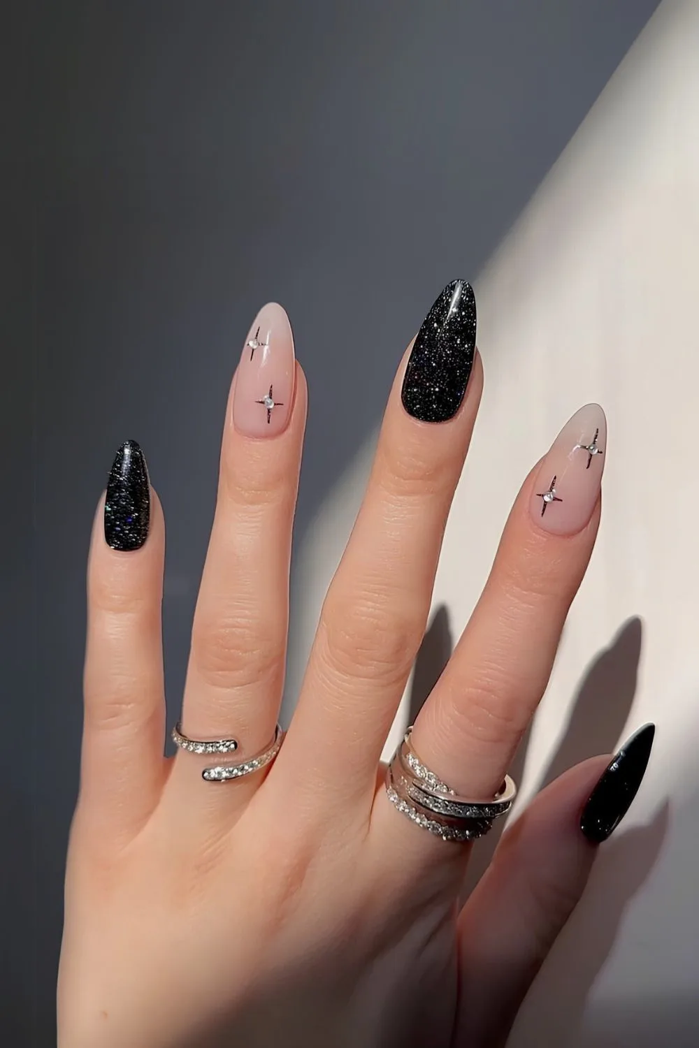 Black mani with glitter and rhinestone stars