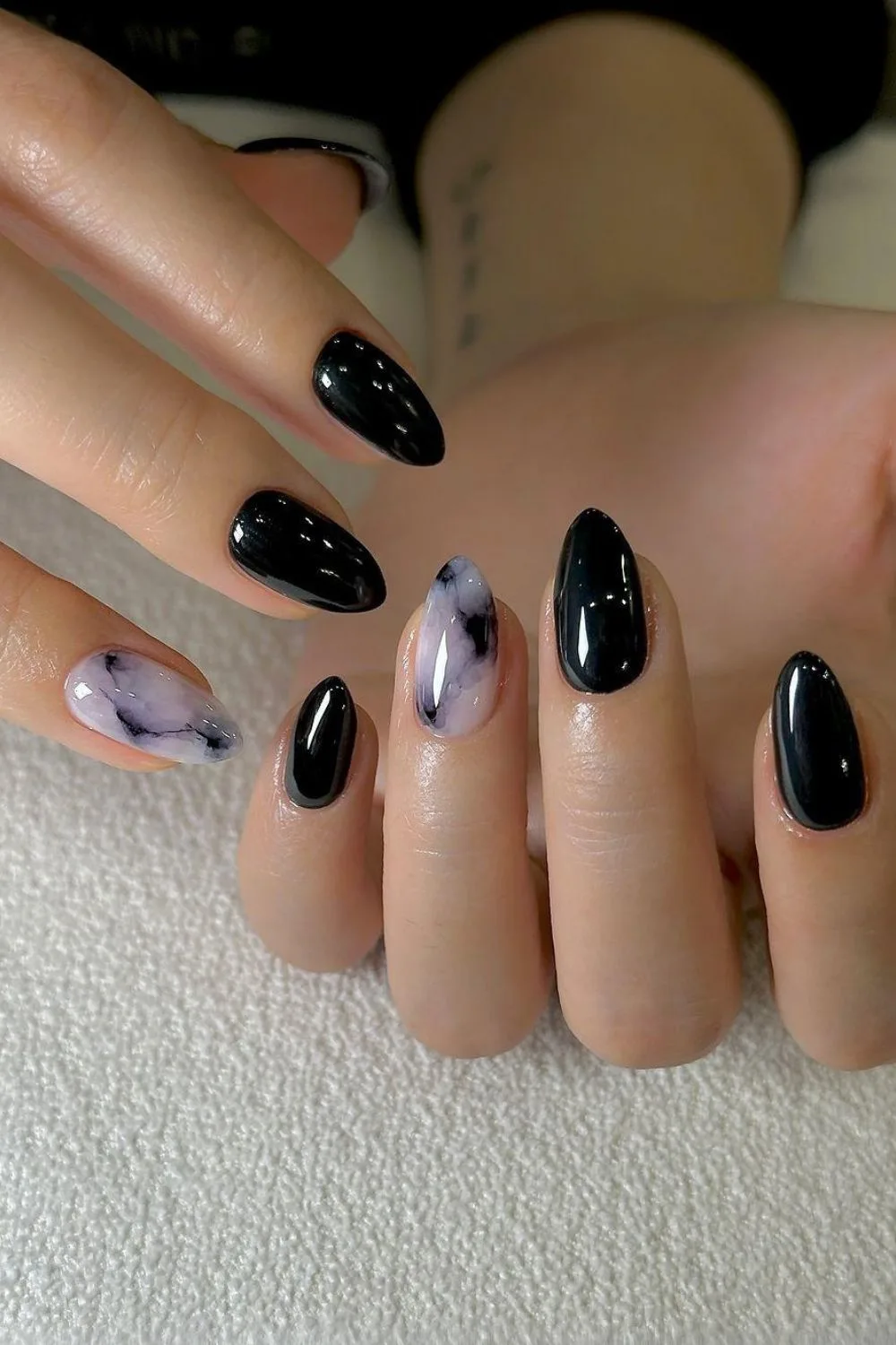 Black manicure with marble accents