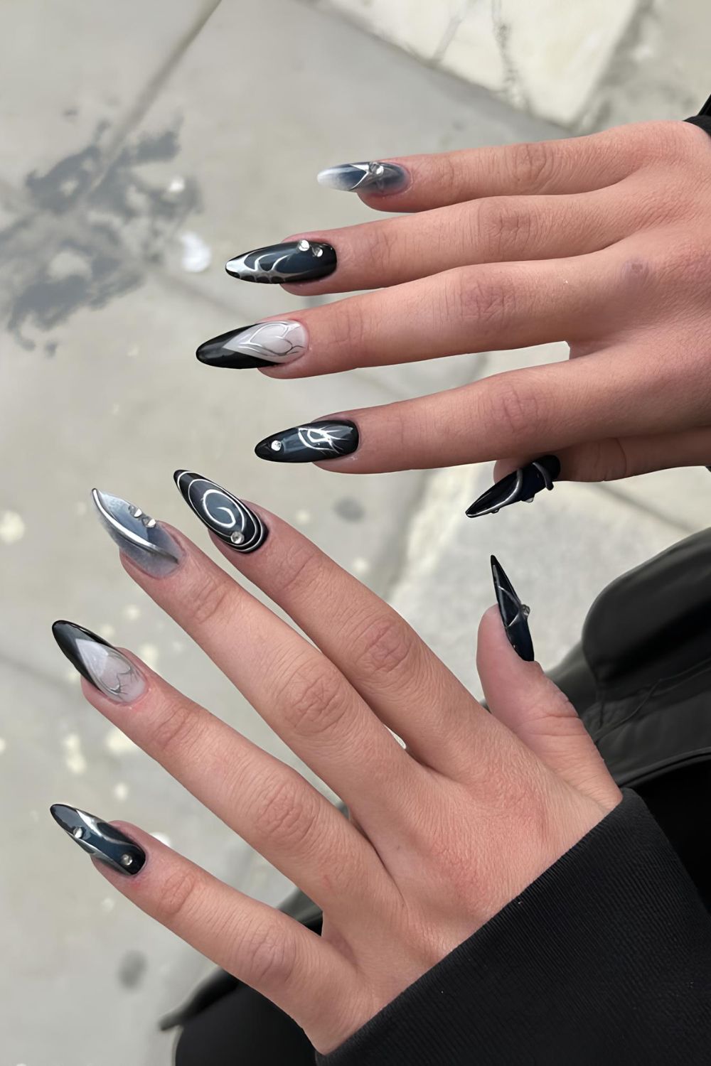 Black mix and match nails with silver chrome accents