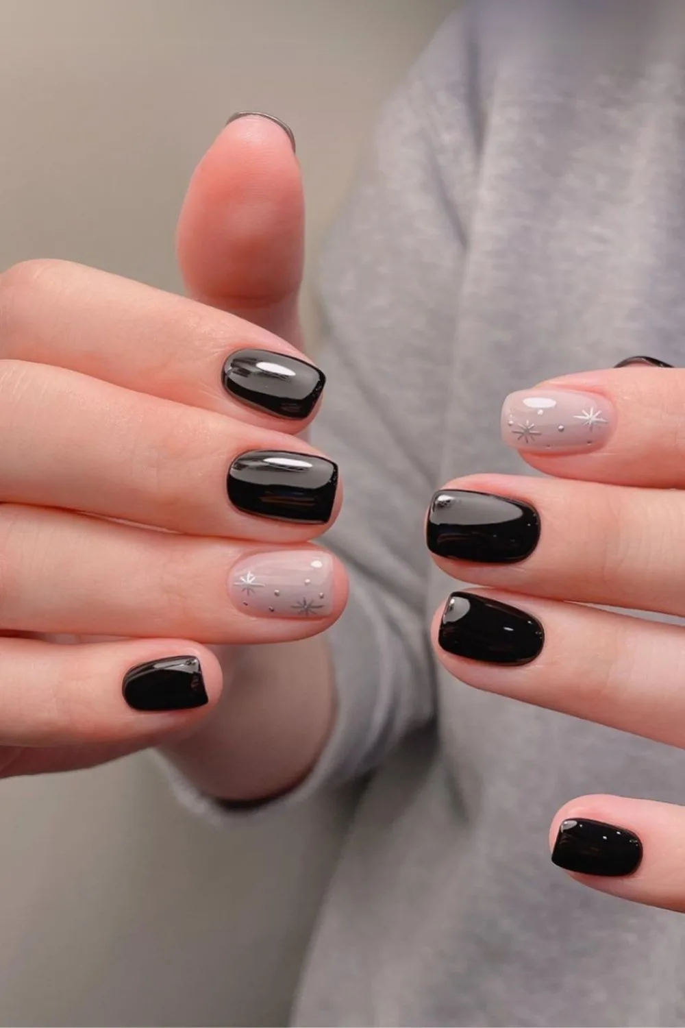 Black nails with chrome star accents