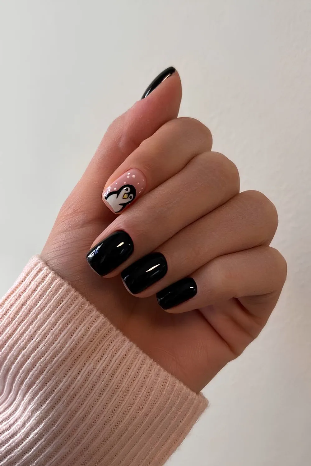 Black nails with cute penguin art