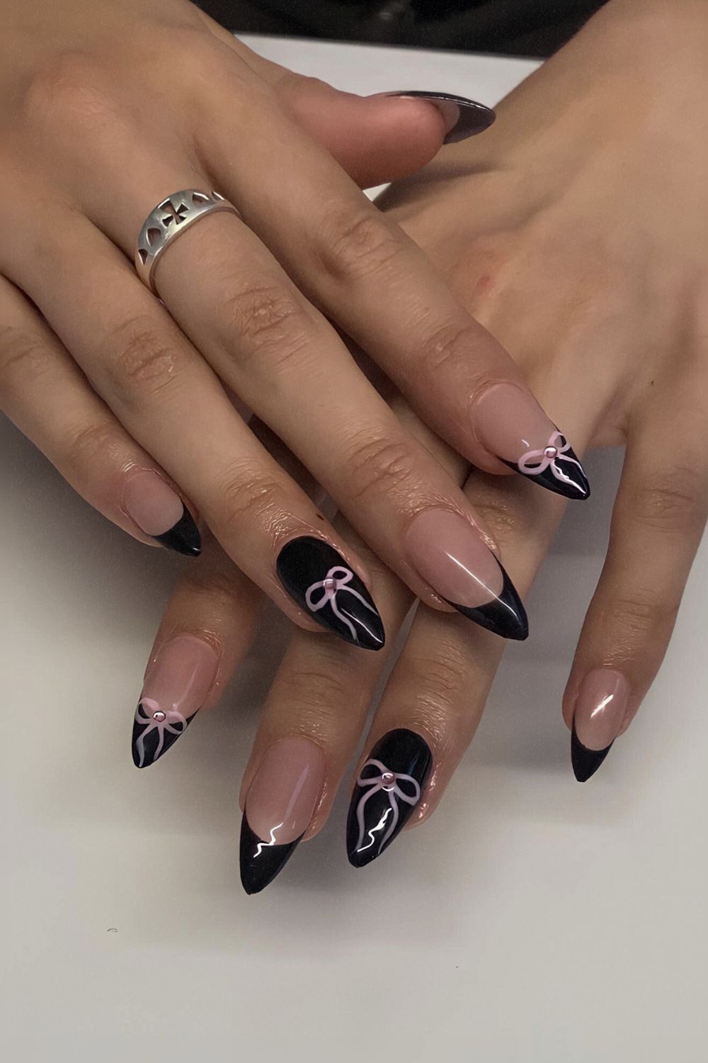 Black nails with pink coquette bows