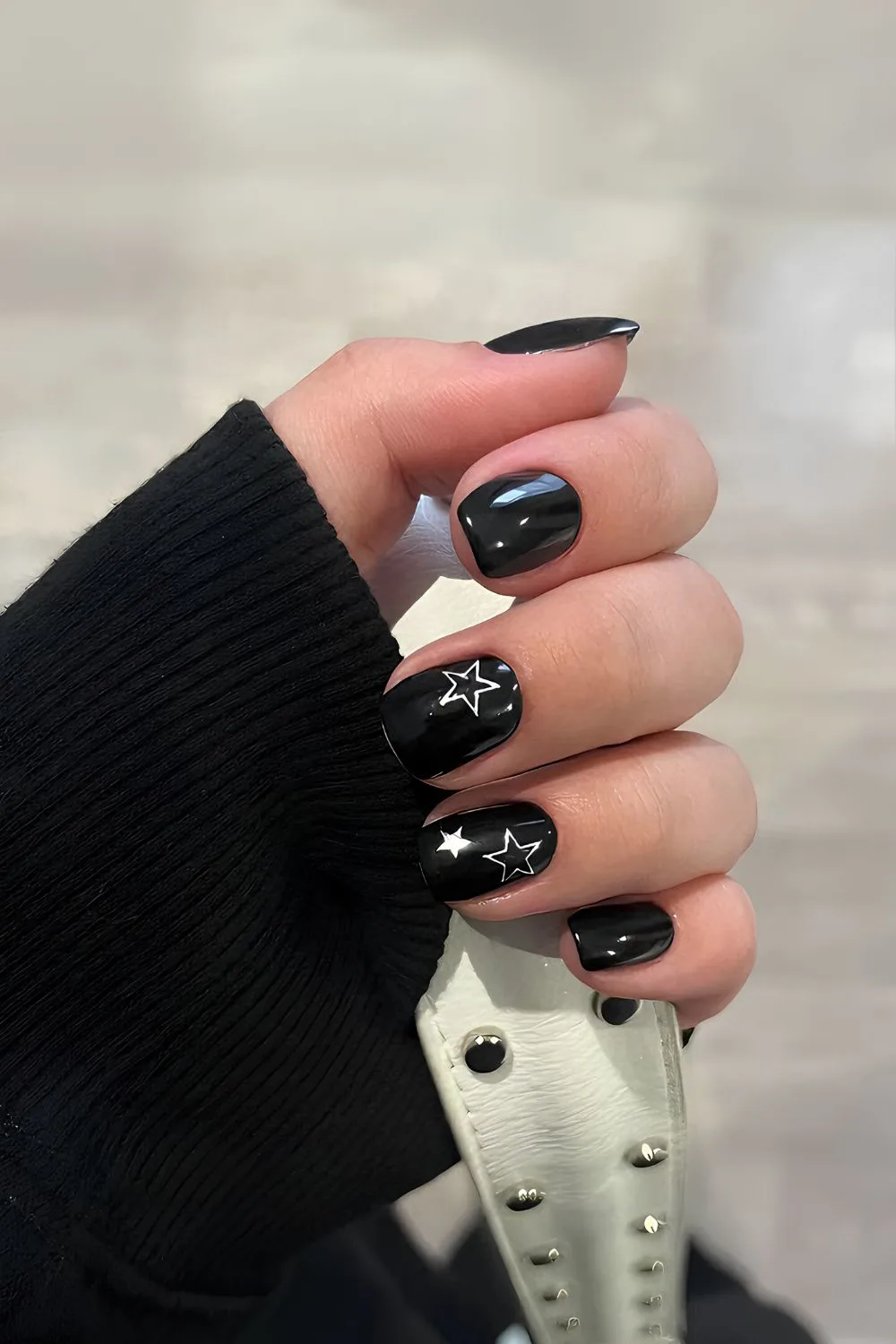 Black nails with white star accents