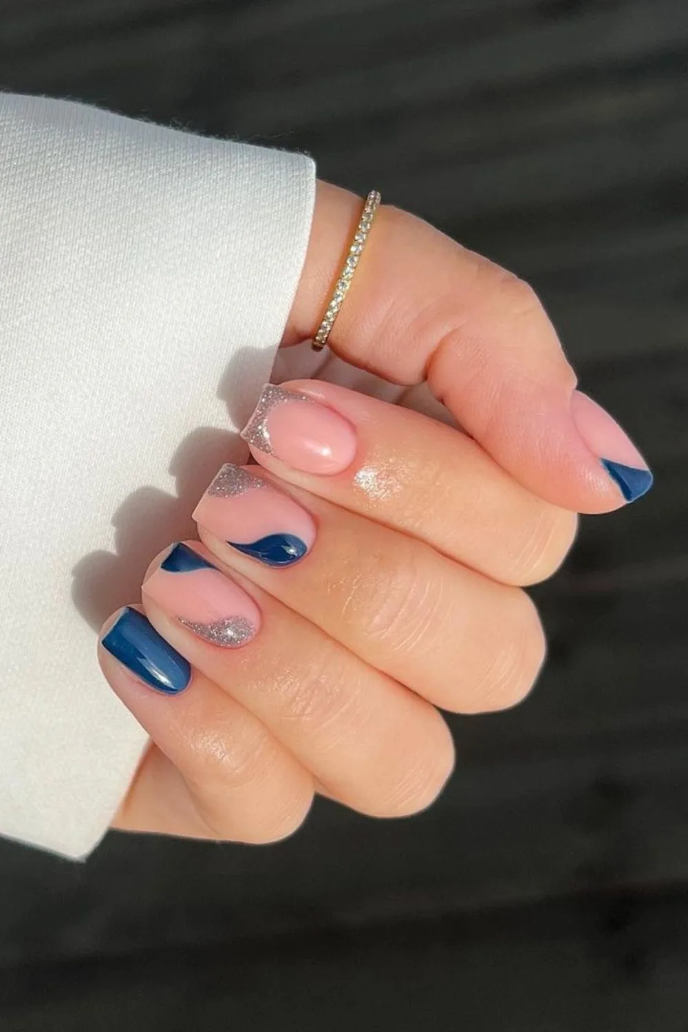 Blue and silver nails with negative space design