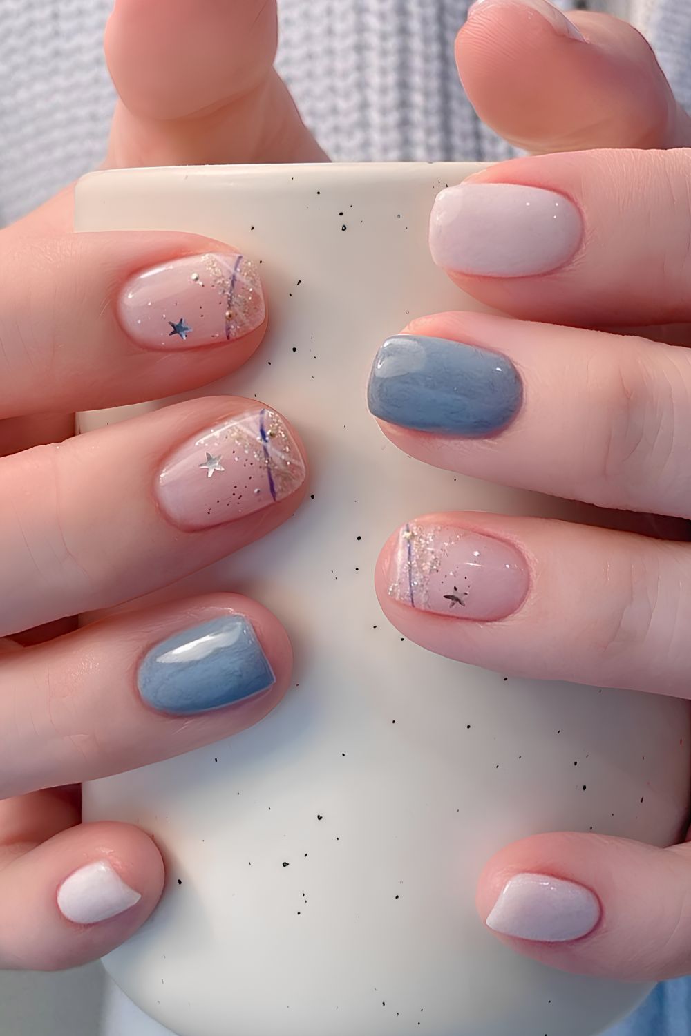 Blue and white nails with glitter and star decals