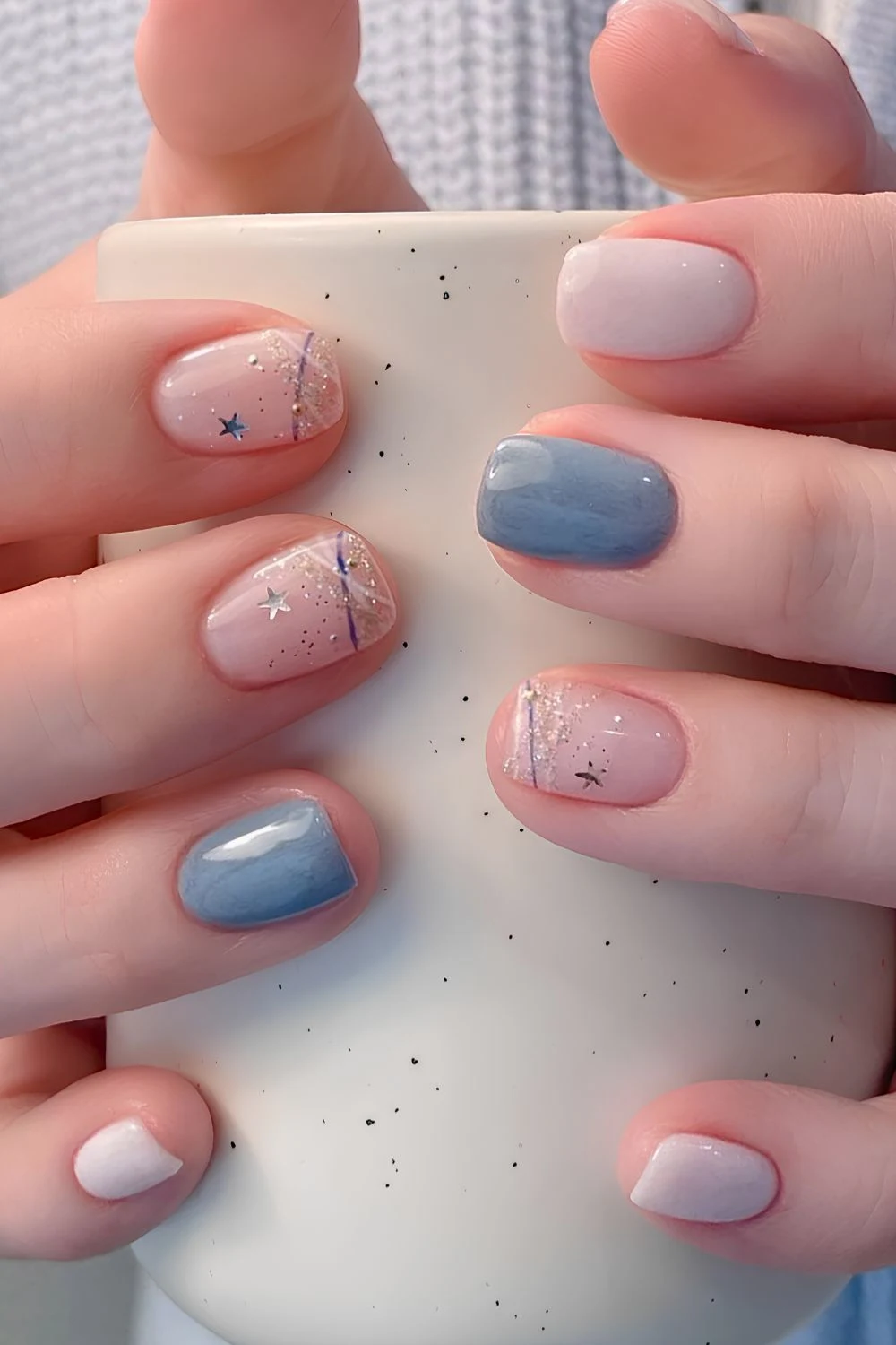 Blue and white nails with glitter and star decals