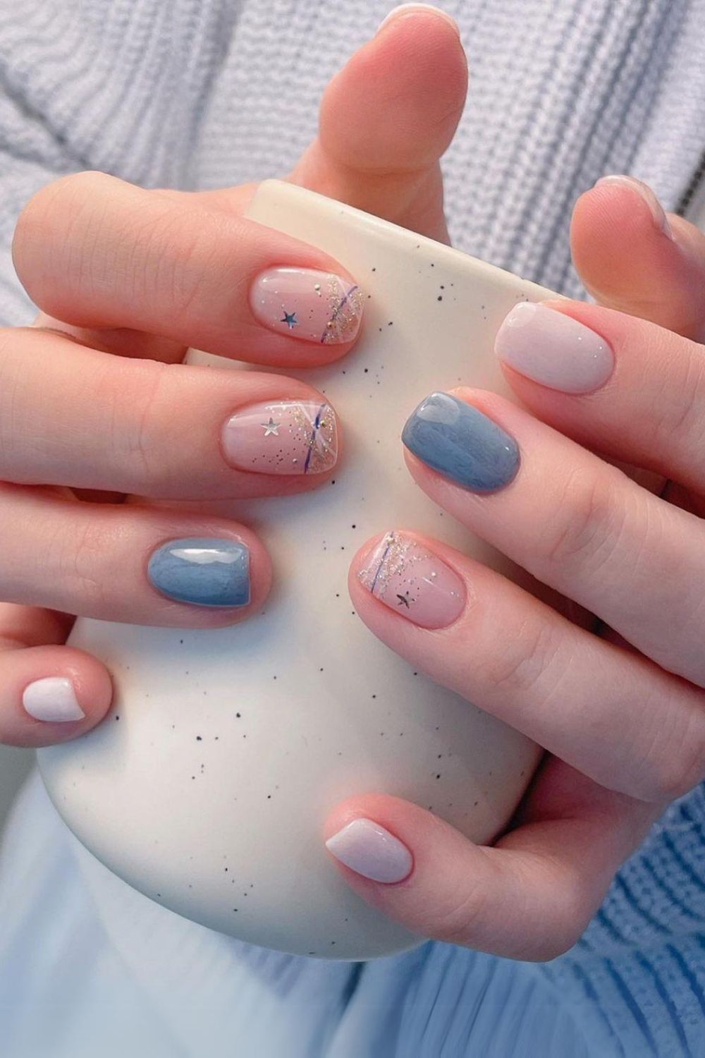 Blue and white nails with glitter and star decals