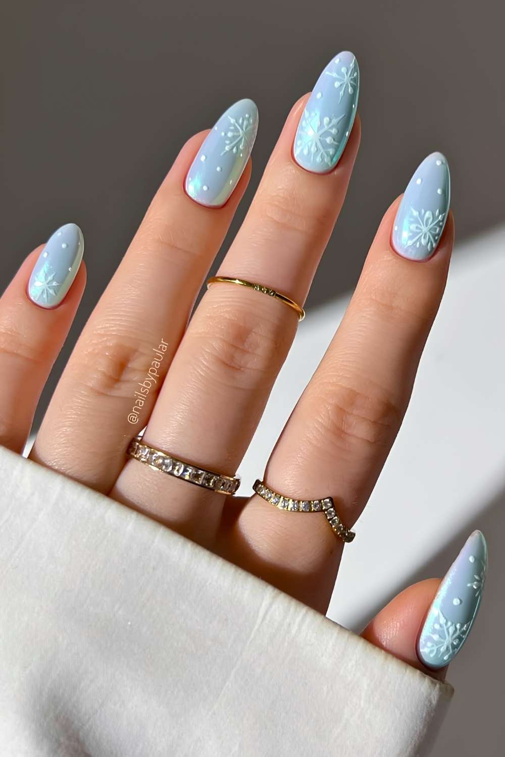 Blue chrome nails with snowflake art