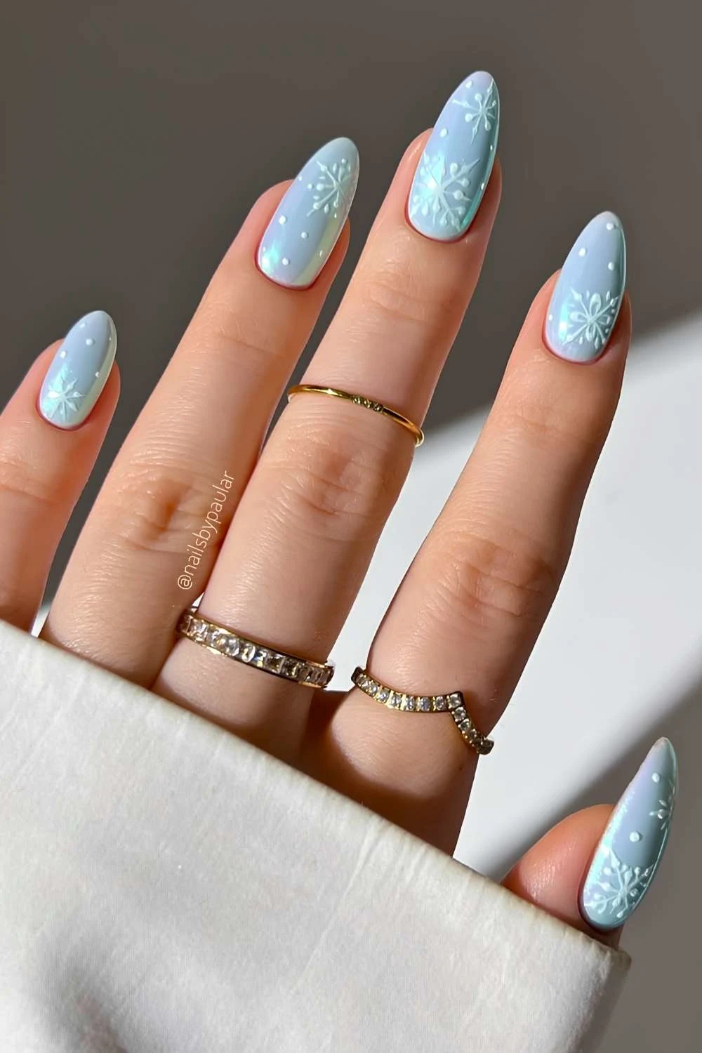 Blue chrome nails with snowflake art