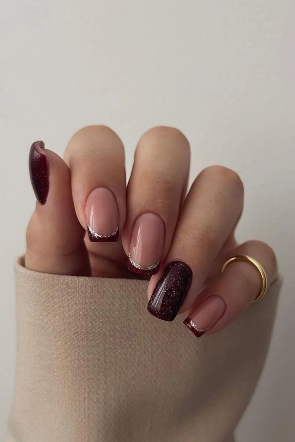 Brown mani with glitter-outlined french tip accent