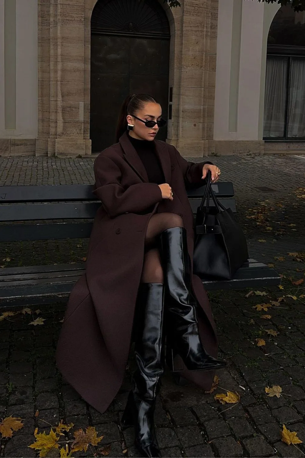 Brown maxi coat with high-knee black boots