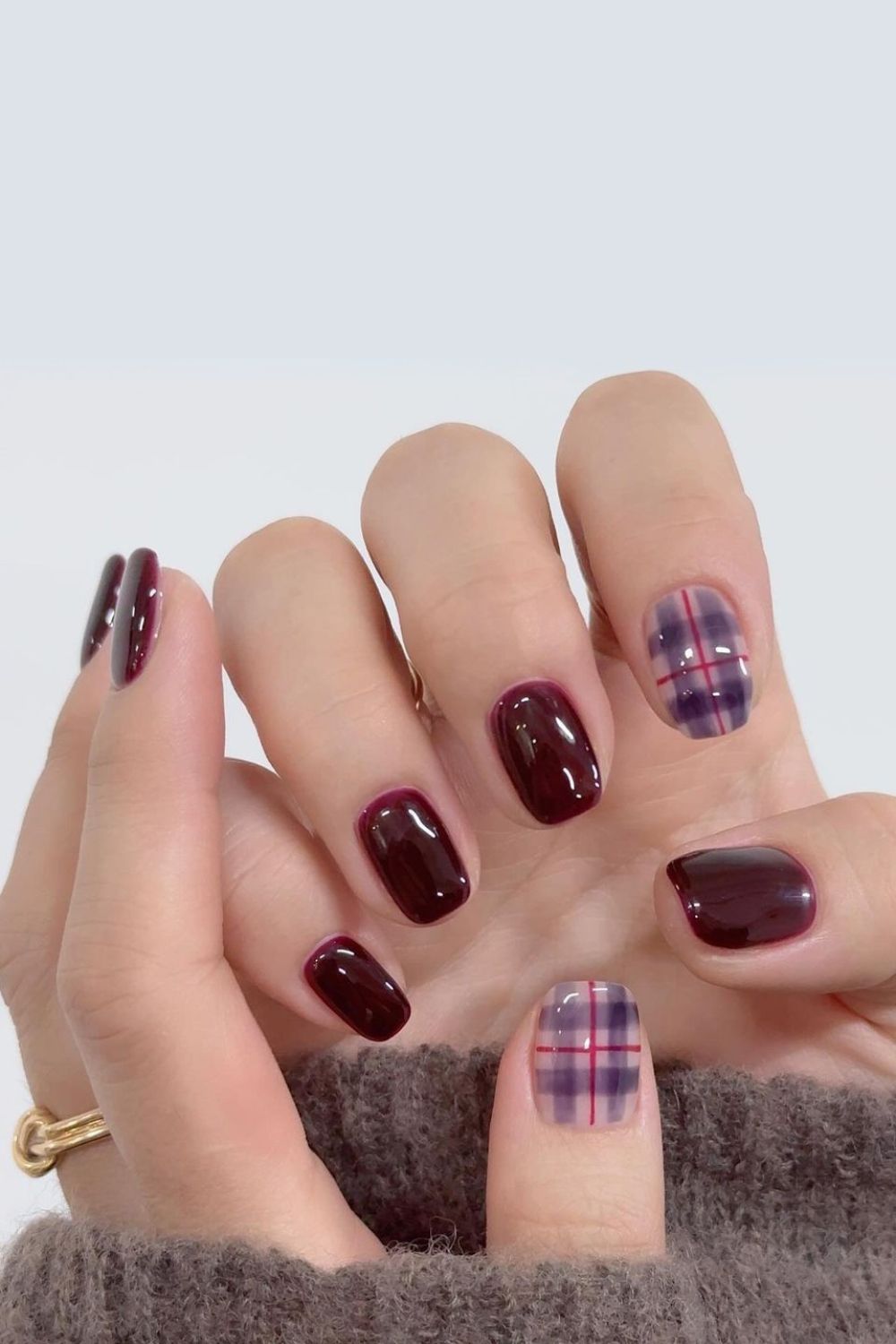 Burgundy nails with plaid accents