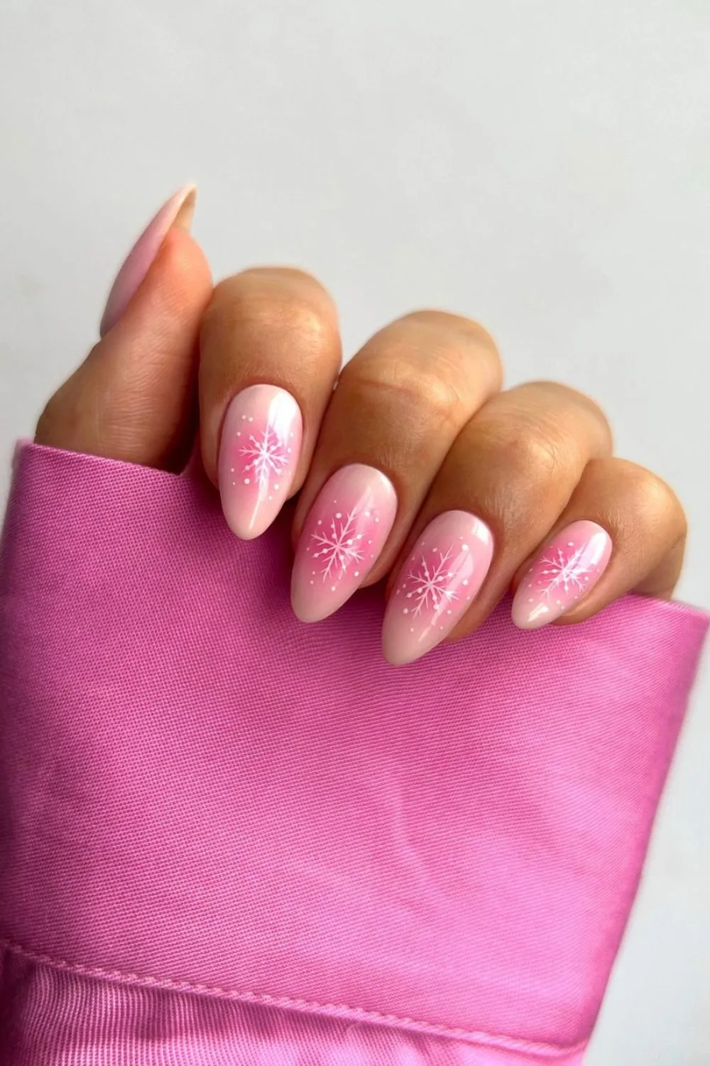 Christmas Pink aura nails with snowflake designs