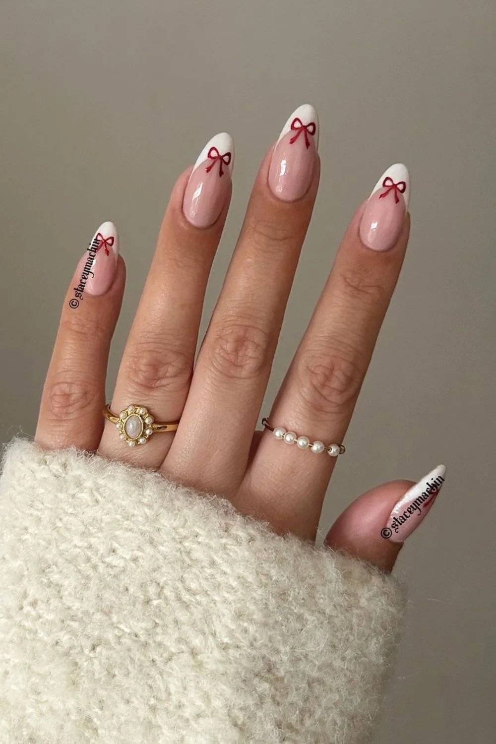 Classic white french mani with red chrome bows