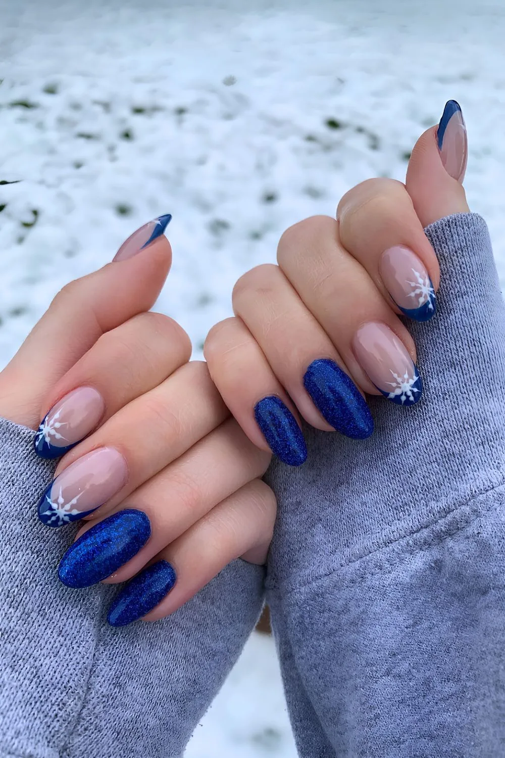 Cobalt blue nails with snowflake accents