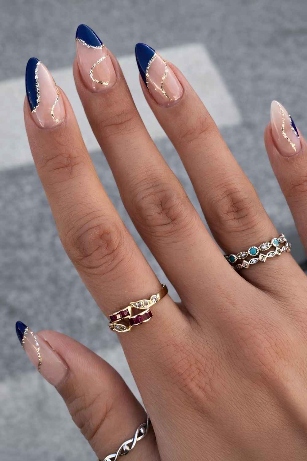 Dark blue abstract French nails with glitter